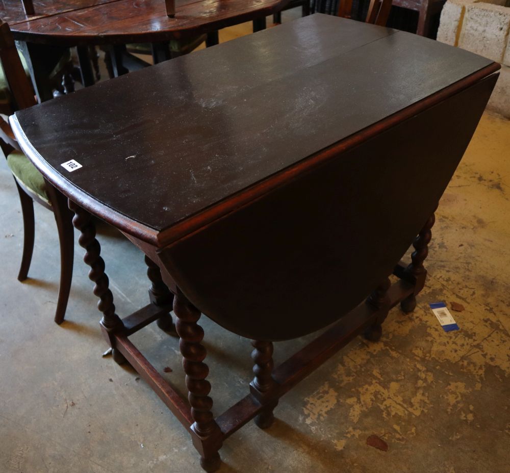 A 1920s oak gateleg table, with spiral twist underframe, width 91cm